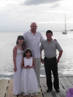 Jose at wedding with flower girl