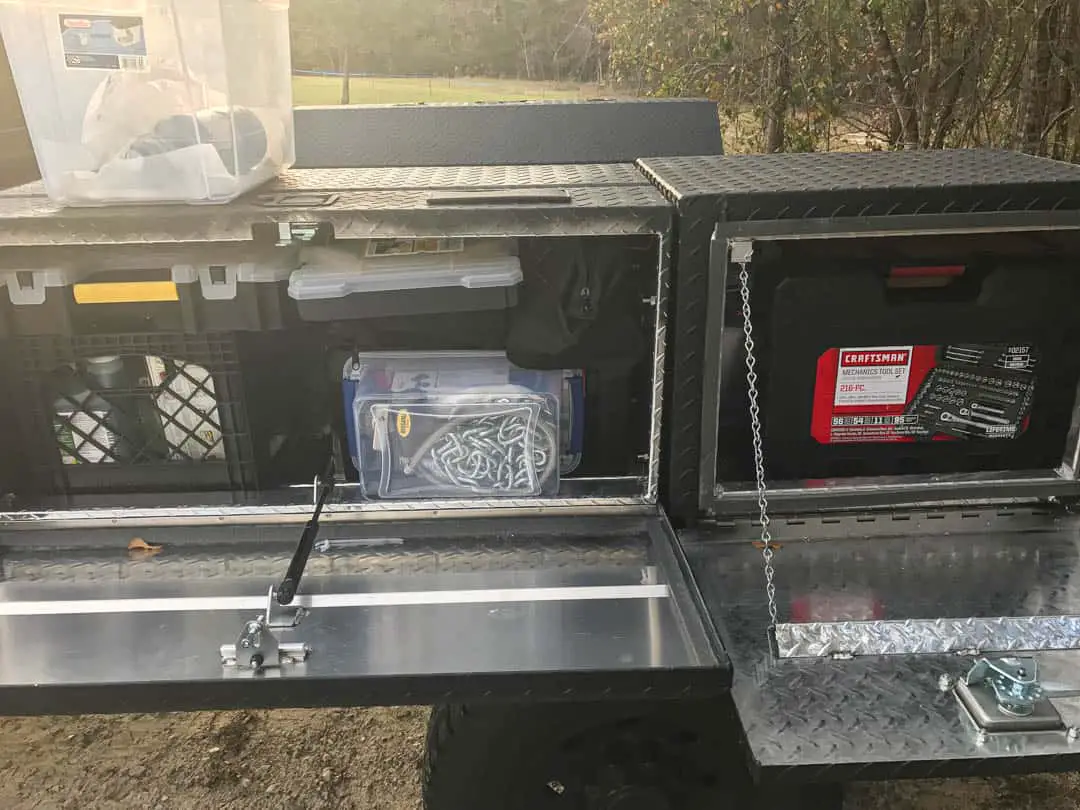 Storage boxes mounted to flatbed truck camper