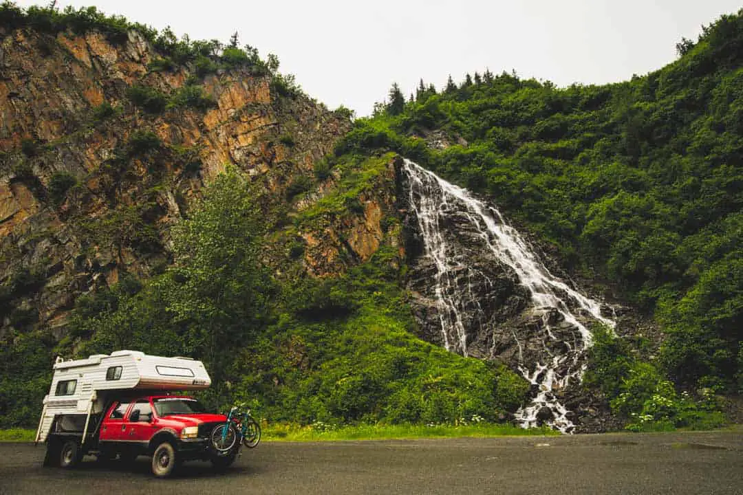 Truck next to waterfall in Valdez AK