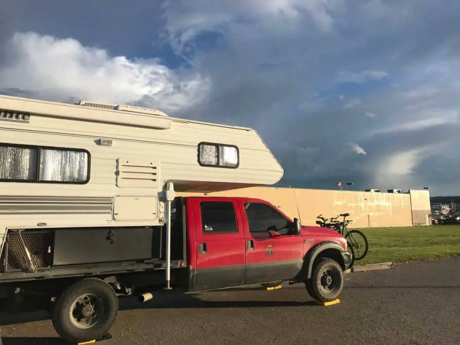 Truck Camper camping in a wal mart parking lot