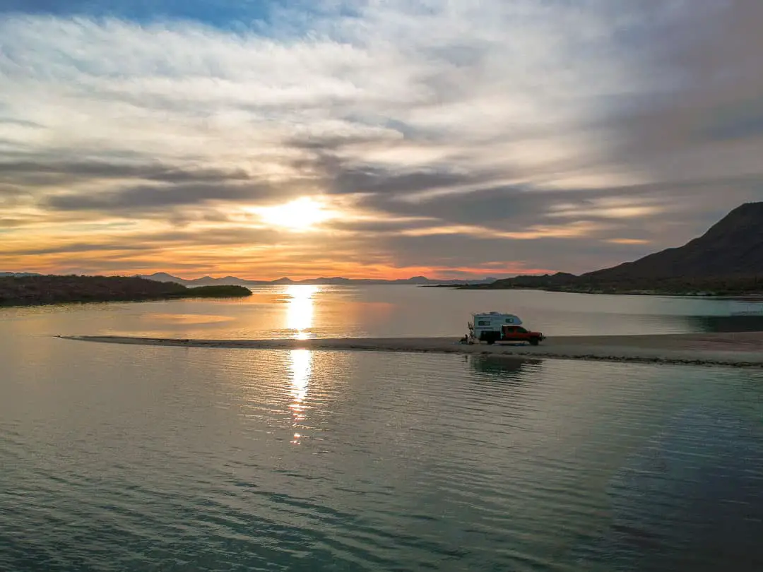 Drone view of Truck camper camping on El Requeson beach