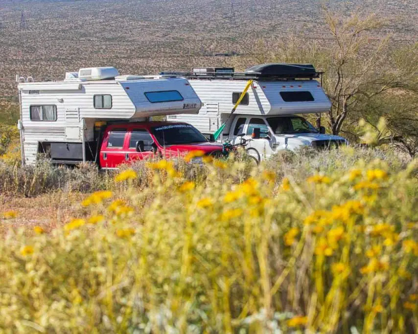 Two truck campers boondocking at Joshua Tree