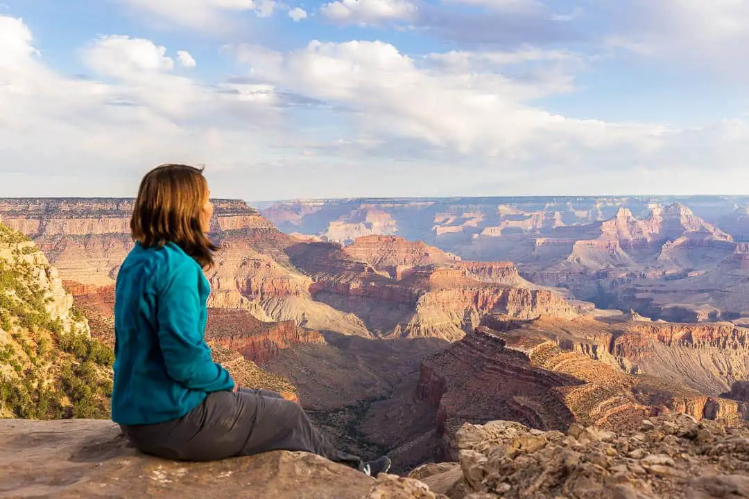 Lindsay sitting on the edge of the Grand Canyon