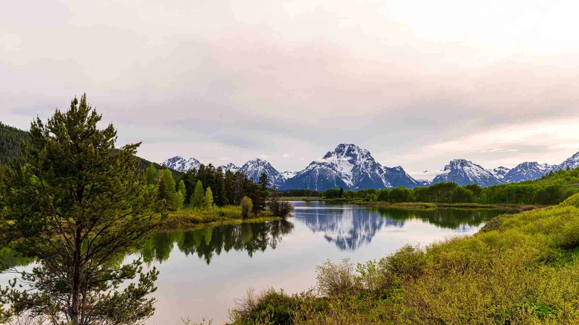 River bend with scenic mountain range in the background