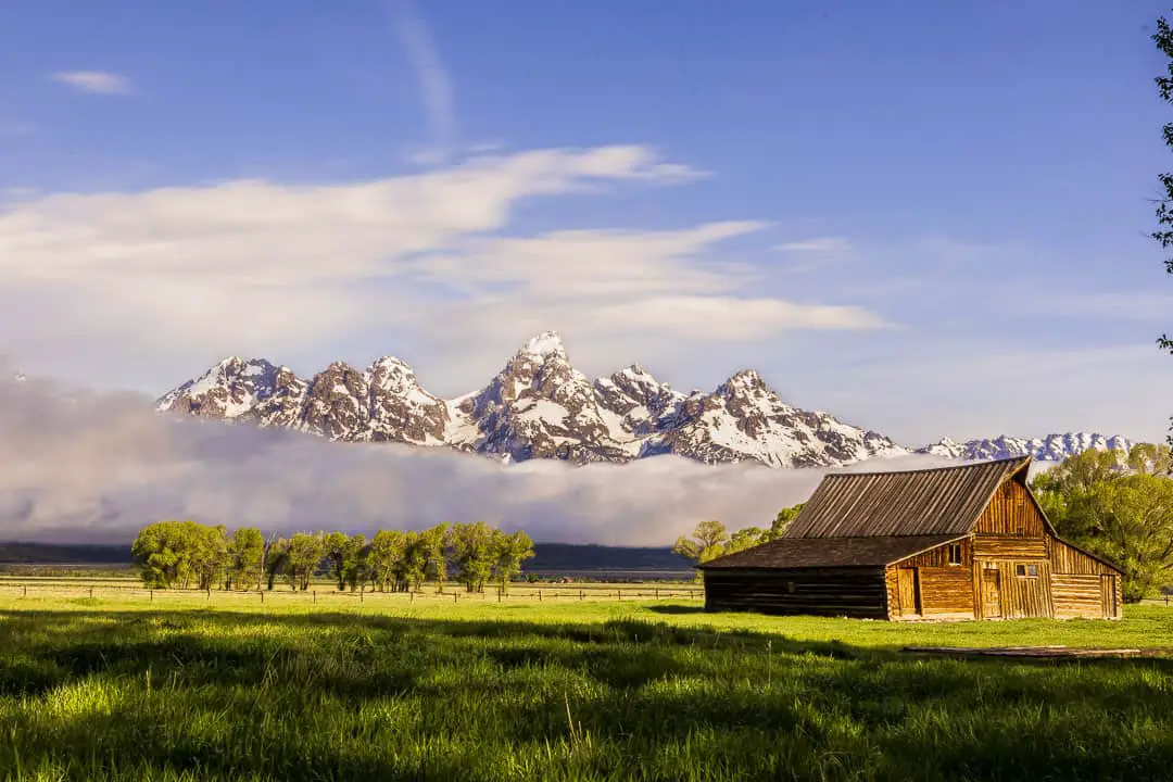 Old barn with a scenic view of the Teton mountain range