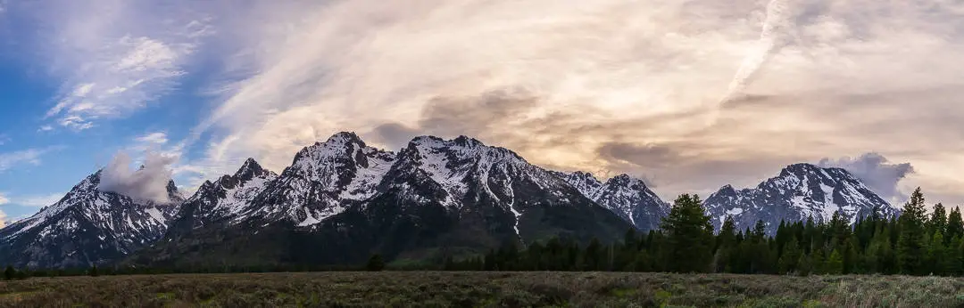 Panoramic view of the Grand Teton mountain range
