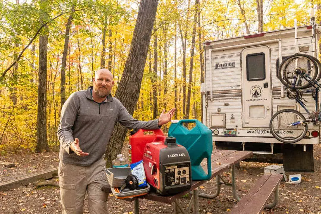 Man posing with truck camper essentials