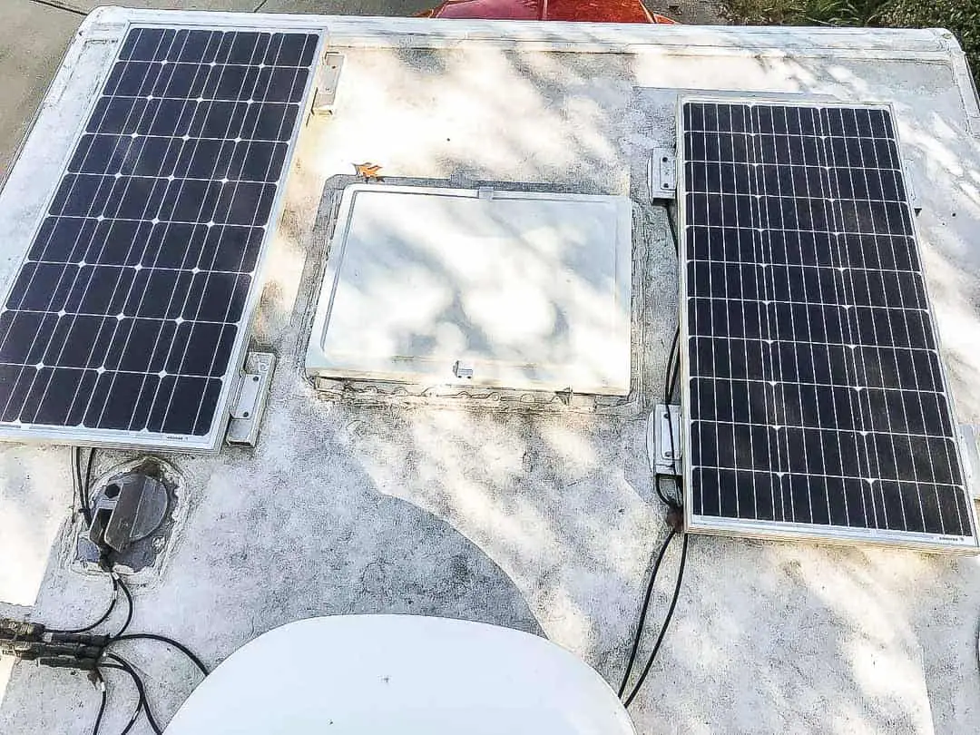 Two solar panels and vent on a RV roof