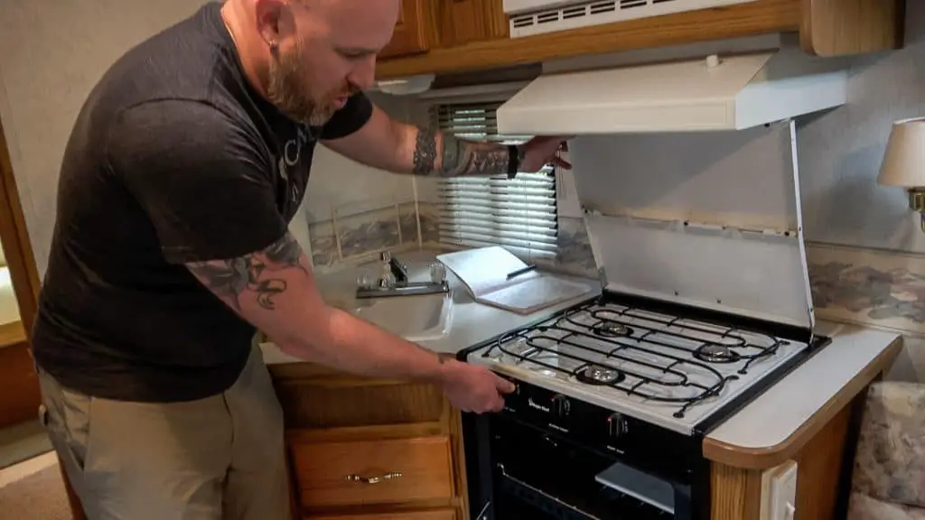 Checking an RV stove as part of a used RV checklist