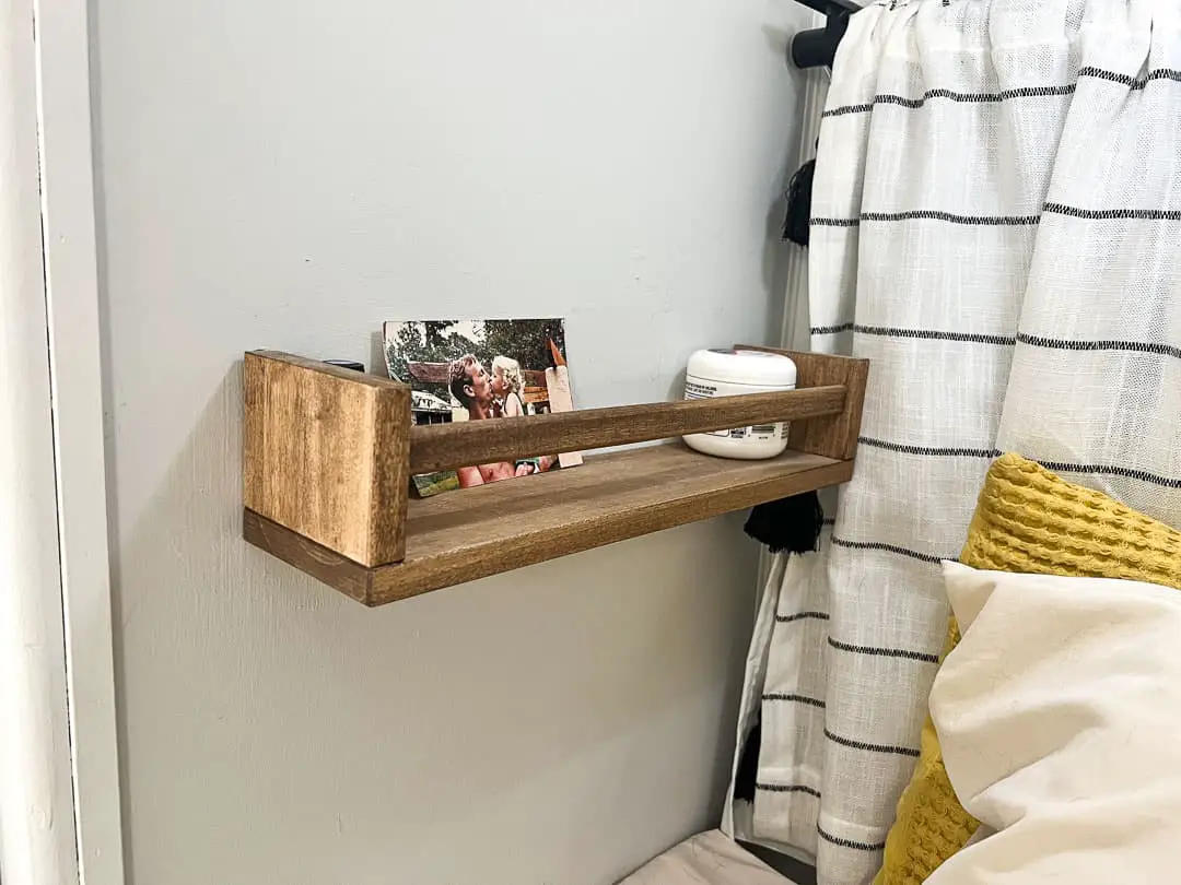 IKEA spice rack as bedside shelves in a RV bedroom
