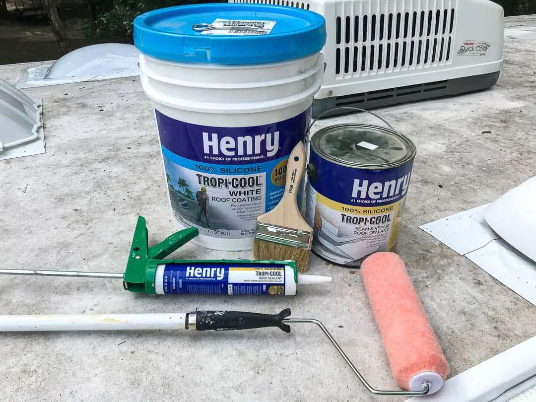5 gallon bucket of Henry's tropicool and tools needed to complete the job on a RV roof