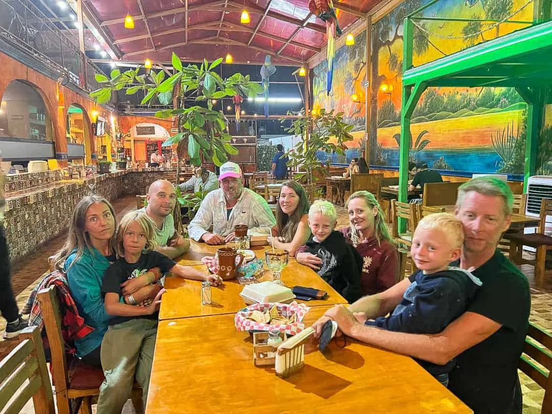 A group of friends sitting at a table in a restaurant 